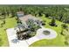 A captivating aerial view showcases lush landscaping and a circular drive enhancing this home's curb appeal at 20207 71St E Ave, Bradenton, FL 34211