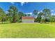 Detached three car garage with abundant parking in the large front yard on a sunny day at 20207 71St E Ave, Bradenton, FL 34211