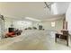 Spacious three car garage interior features ample room for vehicles and storage at 20207 71St E Ave, Bradenton, FL 34211