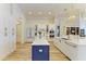 Elegant kitchen featuring custom white cabinetry, marble countertops, and modern stainless steel appliances at 20207 71St E Ave, Bradenton, FL 34211