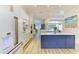 Beautiful kitchen with stainless steel appliances, a marble island, and open access to the living room at 20207 71St E Ave, Bradenton, FL 34211