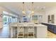Open concept kitchen with a large island, marble countertops, and ample seating at 20207 71St E Ave, Bradenton, FL 34211