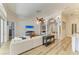 Open concept living room with a large sectional sofa, TV, and access to other areas of the home at 20207 71St E Ave, Bradenton, FL 34211