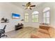 Bright living room with unique architectural details, arched windows, and comfortable seating at 20207 71St E Ave, Bradenton, FL 34211