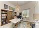 Inviting office space features a modern desk, bookshelf, and natural light, ideal for productivity at 20207 71St E Ave, Bradenton, FL 34211