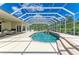 An inviting pool area with covered patio seamlessly extends indoor living outdoors, perfect for relaxing and entertaining at 20207 71St E Ave, Bradenton, FL 34211