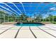 The screened pool features a waterfall and brick trim with an adjacent lounging area for added entertainment at 20207 71St E Ave, Bradenton, FL 34211