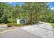 Community entrance sign for Panther Ridge surrounded by lush landscaping and trees at 20207 71St E Ave, Bradenton, FL 34211
