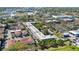 Aerial view showcasing community with lush landscaping, parking, nearby stadium and convenient amenities at 2155 Wood St # A26, Sarasota, FL 34237
