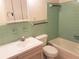 The classic bathroom features a tiled shower/tub, retro-style sink, and ample storage space at 2155 Wood St # A26, Sarasota, FL 34237