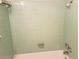 An efficiently designed bathroom offers a tiled shower/tub combination and updated fixtures at 2155 Wood St # A26, Sarasota, FL 34237