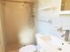 Tiled bathroom featuring a shower, toilet and bright white sink at 2155 Wood St # A26, Sarasota, FL 34237