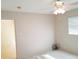 Bedroom with ceiling fan and view into other room and lots of natural light at 2155 Wood St # A26, Sarasota, FL 34237