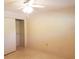 Bright bedroom boasts a ceiling fan, light walls, and closet with sliding doors at 2155 Wood St # A26, Sarasota, FL 34237