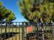 A glimpse of the pristine community park beyond the secured, residents-only access gate, offering green space and recreation at 2155 Wood St # A26, Sarasota, FL 34237