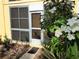 Exterior view of residence featuring flowering tree at 2155 Wood St # A26, Sarasota, FL 34237