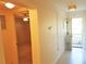 Clean hallway with neutral paint and well lit with outdoor views at 2155 Wood St # A26, Sarasota, FL 34237