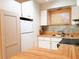 This practical kitchen features butcher block countertops and white appliances, with ample storage at 2155 Wood St # A26, Sarasota, FL 34237