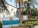Sign for Payne Park Tennis Center, showcasing the community's recreational facilities and lush landscaping at 2155 Wood St # A26, Sarasota, FL 34237