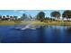 Serene pond view with a fountain, creating a picturesque setting with a rainbow, enhancing the outdoor appeal at 2155 Wood St # A26, Sarasota, FL 34237
