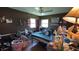 Bedroom with natural lighting, laminate floors, and dark-painted walls at 23067 Elmira Blvd, Punta Gorda, FL 33980