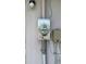 Close-up of a gray electric meter attached to an exterior wall with visible wiring at 23067 Elmira Blvd, Punta Gorda, FL 33980