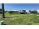 Charming single-story home with a well-maintained lawn and a stone facade and driveway at 23067 Elmira Blvd, Punta Gorda, FL 33980