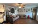 A cozy living room featuring laminate floors and ample decor on the walls at 23067 Elmira Blvd, Punta Gorda, FL 33980