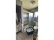 Bathroom with grey shower and sliding glass door at 23067 Elmira Blvd, Punta Gorda, FL 33980