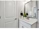 Elegant bathroom featuring a white vanity with a sleek countertop and modern fixtures at 2500 Boone Ct, Sarasota, FL 34237