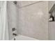 Modern bathroom showcasing a tiled shower with shampoo bottles in a built-in tiled niche at 2500 Boone Ct, Sarasota, FL 34237