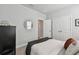 Relaxing bedroom featuring soft carpet, a modern style mirror, neutral colors and natural light at 2500 Boone Ct, Sarasota, FL 34237