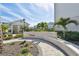 Exterior of community sign surrounded by landscaping and bright blue skies at 2500 Boone Ct, Sarasota, FL 34237