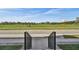 Scenic view from the property overlooking a green field and neighborhood building at 2500 Boone Ct, Sarasota, FL 34237