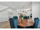Elegant dining room featuring a round table and a view into the kitchen at 2500 Boone Ct, Sarasota, FL 34237