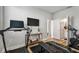 Bright exercise room features a treadmill, stationary bike, and a modern television at 2500 Boone Ct, Sarasota, FL 34237
