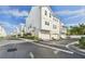 Well-maintained townhomes boast attached garages, manicured landscaping, and a pristine exterior at 2500 Boone Ct, Sarasota, FL 34237