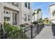 Inviting townhome features a cozy fenced-in patio area, a charming front entry, and lush landscaping at 2500 Boone Ct, Sarasota, FL 34237