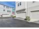 Clean two car garages are visible in this street view from the outside of the property at 2500 Boone Ct, Sarasota, FL 34237