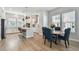 Bright kitchen boasts white cabinets, a large island, and modern stainless steel appliances at 2500 Boone Ct, Sarasota, FL 34237