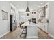 Modern kitchen with white cabinets, stainless steel appliances, and center island with counter seating at 2500 Boone Ct, Sarasota, FL 34237