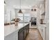Bright kitchen featuring white cabinets, stainless appliances, and a large center island with bar seating at 2500 Boone Ct, Sarasota, FL 34237