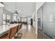 Open-concept view showcases the kitchen island, living room with modern furnishings, and abundant natural light at 2500 Boone Ct, Sarasota, FL 34237