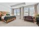 Spacious main bedroom suite offers comfort with lots of natural light and a seating area at 2500 Boone Ct, Sarasota, FL 34237
