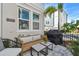 Cozy patio setup includes outdoor seating, a grill, and a charming garden, perfect for outdoor entertaining at 2500 Boone Ct, Sarasota, FL 34237