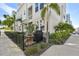 Relaxing outdoor patio features a grill, comfortable seating, and lush landscaping at 2500 Boone Ct, Sarasota, FL 34237