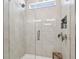 Modern glass shower with tiled walls, a rainfall showerhead, and a built-in niche at 2500 Boone Ct, Sarasota, FL 34237