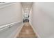 Bright staircase featuring wood stairs and white railings, leading to the upper level at 2500 Boone Ct, Sarasota, FL 34237
