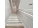 Staircase features light-colored steps and railings at 2500 Boone Ct, Sarasota, FL 34237