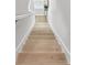 Bright stairway features wood treads and white risers that lead up to the second floor at 2500 Boone Ct, Sarasota, FL 34237